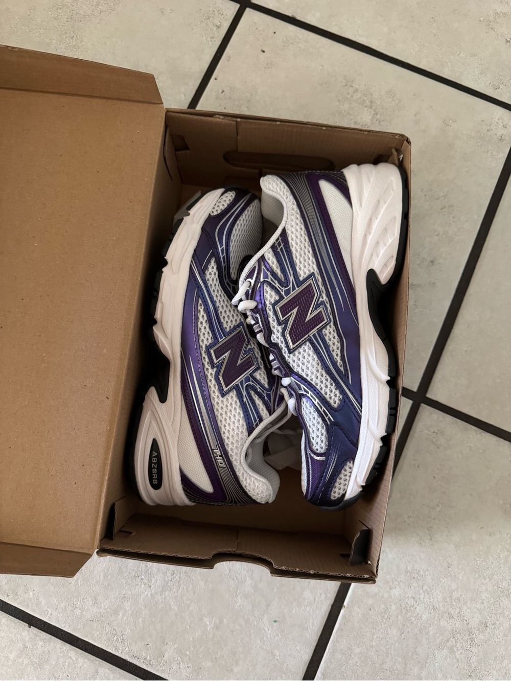 New Balance White and Purple Sneakers